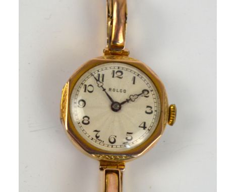 ROLCO; a 1930s 9ct yellow gold cased manual lady's wristwatch, the circular guilloche decorated dial set with Arabic numerals