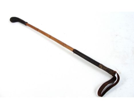 An unusual Army bamboo shafted and leather riding crop/club, the handle with weighted plaited end, overall length 84cm.