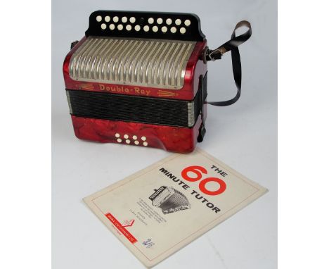 A Hohner "Double-Ray" accordion and "The Sixty Minute Tutor" (2).