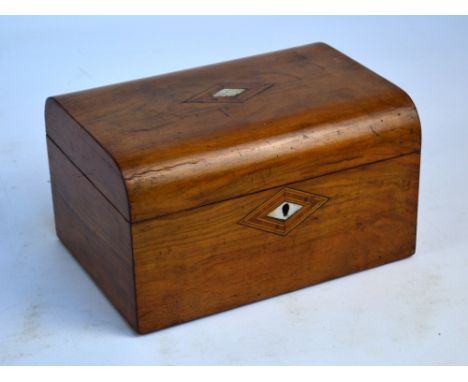 A Victorian walnut trinket/jewellery box centred with a mother of pearl and inlaid lozenge to the hinged lid enclosing a fitt