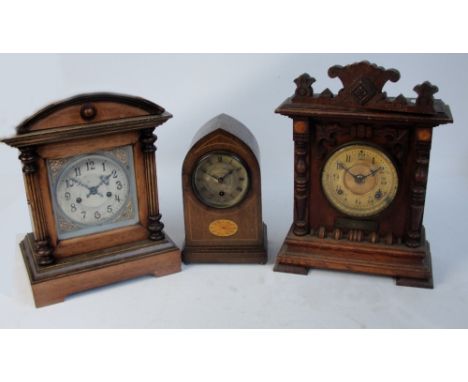 Three late 19th/early 20th century mantel clocks, comprising a wooden framed American eight day Senica Ansonia clock, a lance