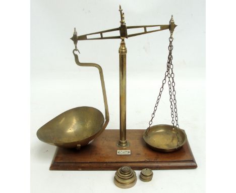 A set of brass beam scales on rectangular mahogany base, with ivory plaque inscribed "RW LOMAS, 24 SWAN STREET MANCHESTER", 4