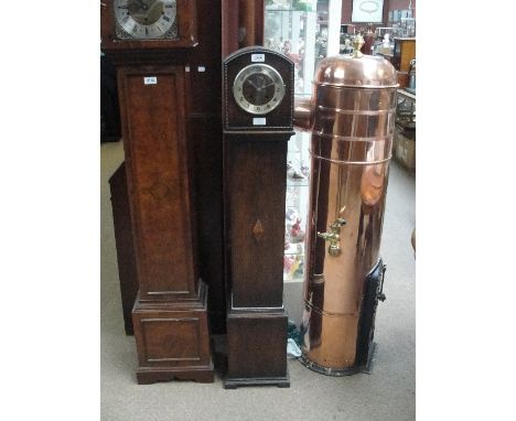 A 1930s oak Art Deco style grandmother clock with applied beading and geometric lozenge decoration, with curved top, the silv