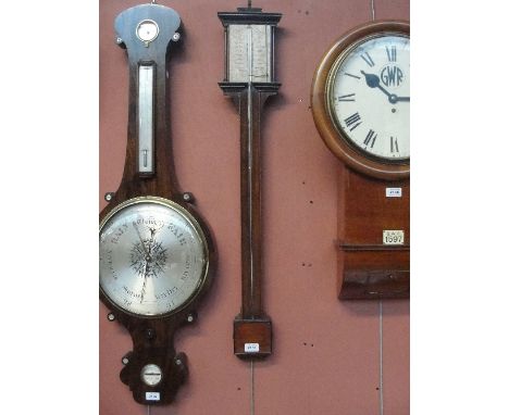 An early 19th century mahogany stick barometer of simple form with replaced paper dial, length 96cm.