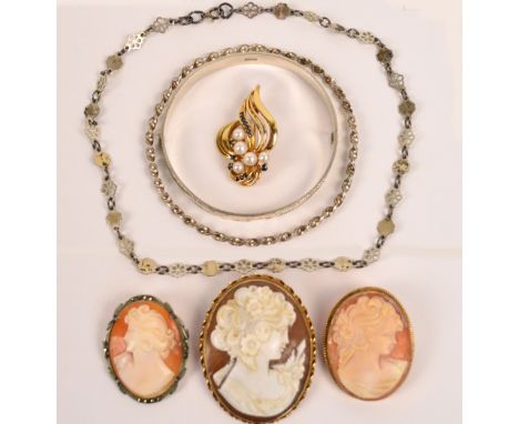 Two 9ct yellow gold mounted oval cameo brooches depicting busts of young women and a base metal example, a 9ct yellow gold br