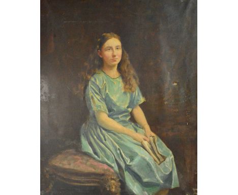 FRANK KING; oil on canvas, portrait study of a seated young woman wearing green dress and holding a book, signed and detailed