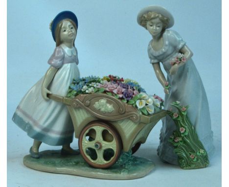 A Lladro figure of a girl pushing a wheelbarrow full of flowers, height 21cm, and a Nadal figure of a woman picking flowers, 