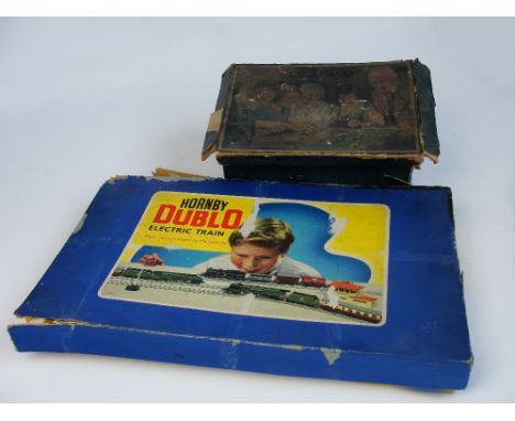 A boxed "Escalado" game complete with four lead horses and linen race course with clamps, and a boxed Hornby Dublo electric t