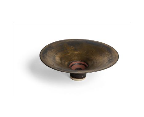 [§] LUCIE RIE D.B.E. (BRITISH, 1902-1995)FOOTED BOWL, LATE 1970S impressed artist's seal, porcelain, golden manganese glaze, 