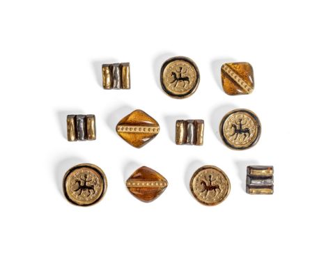 [§] LUCIE RIE D.B.E. (BRITISH, 1902-1995) FOR BIMINI11 BUTTONS pressed glass, with Bimini brass backsthe largest 3.8cm across