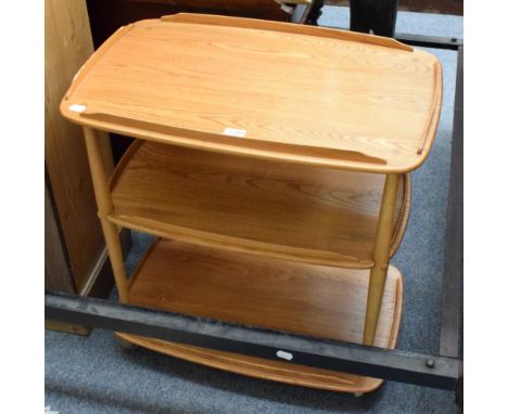 An Ercol light elm three tier trolley; and a modern rug 