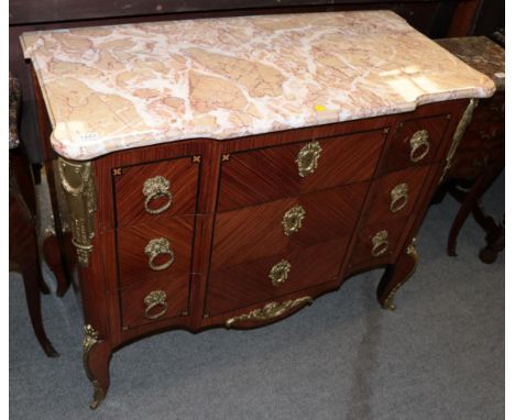 A Louis XV/Transitional style Kingwood and gilt metal mounted commode, 20th century, the pink and marble serpentine shaped ma