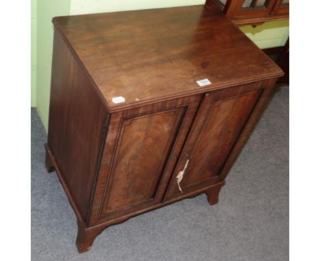 A 19th century mahogany collectors cabinet, the ebony strung doors enclosing 11 sliding trays, on swept bracket feet