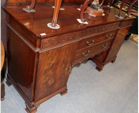 A Chippendale revival carved mahogany breakfront sideboard, late 19th/early 20th century, the galleried back above three Gree