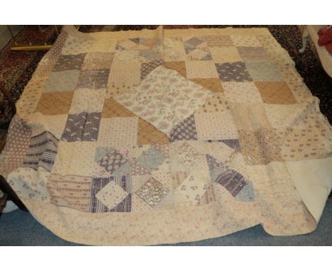 Large late 19th century medallion patchwork quilt, the centre incorporates a cotton panel of pink and blue birds in branches,