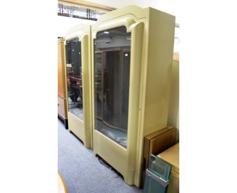 Pair of good quality modern display cabinets with glass shelves and interior lighting, each with a long drawer to the base 