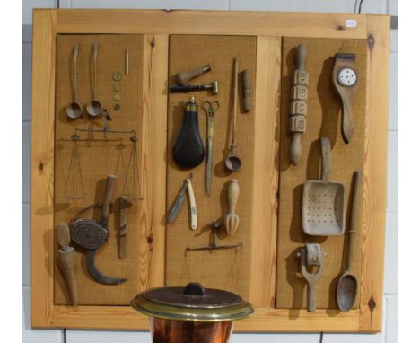 A group of early 18th century and later mostly treen kitchen and other implements including pastry roller, garlic press, shot