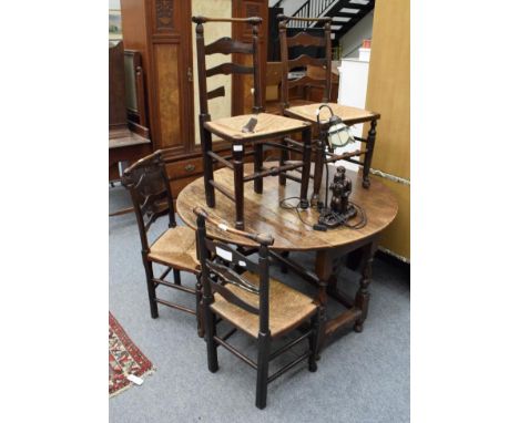 A set of five ladder back rush seated chairs together with an oak gateleg table an a lamp (7)