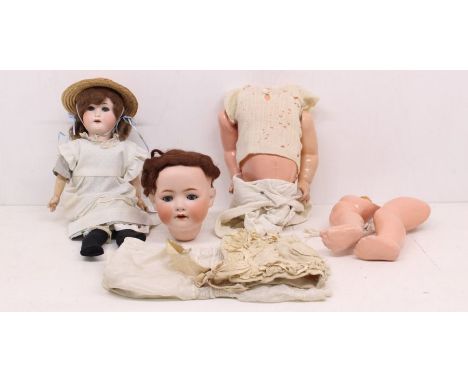 Dolls: A pair of dolls, one with bisque head, the other having composition head, both having composition bodies, open and clo