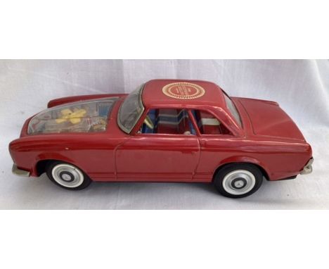 Tinplate: A battery operated Mercedes Car, Made in Japan by Asahi. Model 230SL, with see-through bonnet revealing moving engi