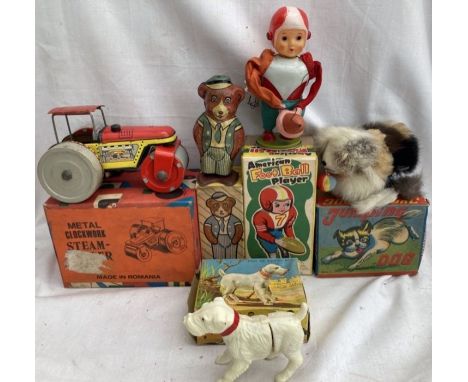 Tinplate: A collection of vintage tinplate clockwork toys to include American Football Player by Fuji(mm) Japan, Steam Roller