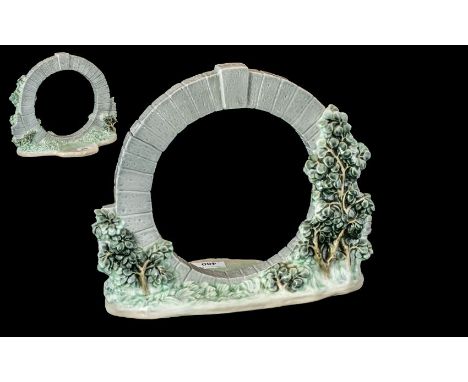 A Lladro Tableau circular garden design. Height 10 1/2 inches, 11 inches wide. 