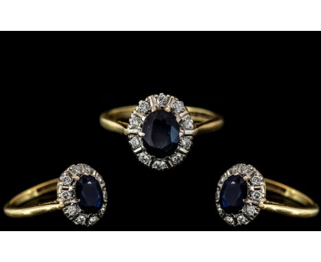 18ct Gold Attractive Sapphire and Diamond Set Cluster Ring, Flower head Design. The Central Blue Sapphire Surrounded by 12 Di