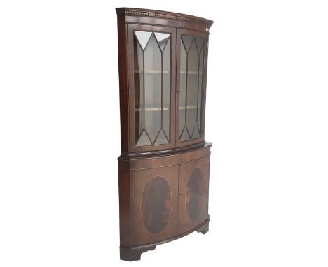 Georgian design mahogany corner cabinet, dentil cornice over pair astragal glazed doors enclosing two shelves, base fitted wi