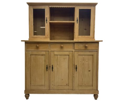 Early 20th century French pine side cabinet or dresser, fitted with two glazed cupboards flanking central shelf, over three d