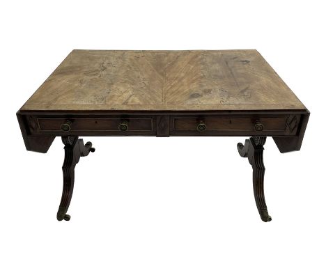 Regency mahogany sofa table, canted rectangular drop leaf top with walnut crossbanding, fitted with two frieze drawers with c