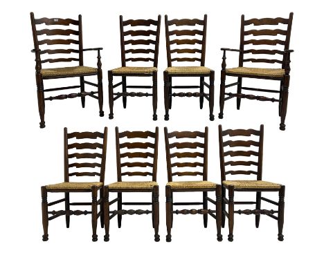 Set eight (6+2) oak dining chairs, high waived ladder back over rush seats, raised on ring turned supports with pad front fee