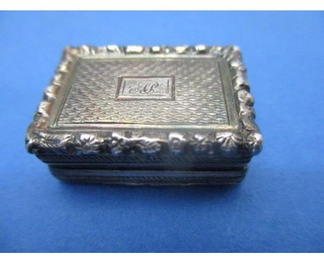 A George III silver vinaigrette probably by Thomas Parker with engine turned decoration, the initialed, cast leaf and flower 