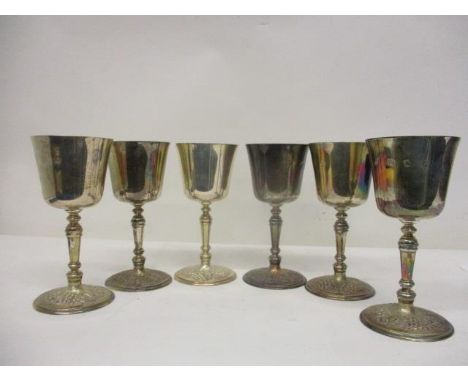 A set of six silver goblets by Mappin &amp; Webb, London 1972, with turned stems and fruiting vine decorated foot, 5 3/4" h, 