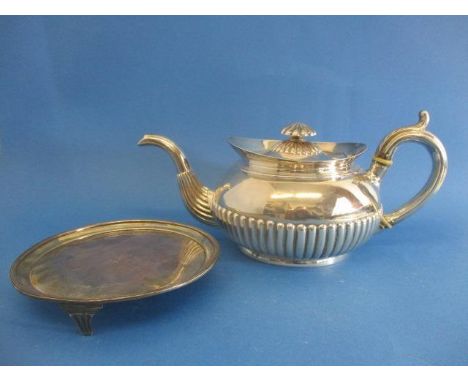 A George III Irish silver teapot and stand by James Scott, Dublin 1804, the teapot with a flared lip, a bulbous, demi reeded 