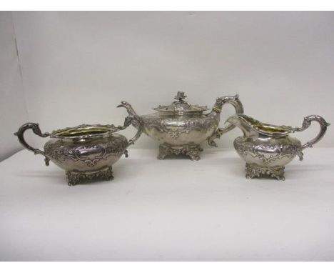 A William IV silver three piece teaset by Leonard Urquhart, Edinburgh 1834 with embossed, chased floral and scrolled ornament