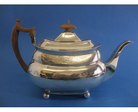 A George III silver teapot by Samuel Godbehere, Edward Wigan, James Boult, London 1810 of oval bellied form with floral engra