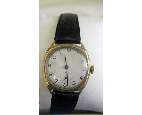 A 9ct gold cased gentleman's wristwatch, the dial with subsidiary seconds dial at six, the case inscribed Meteor, on a black 