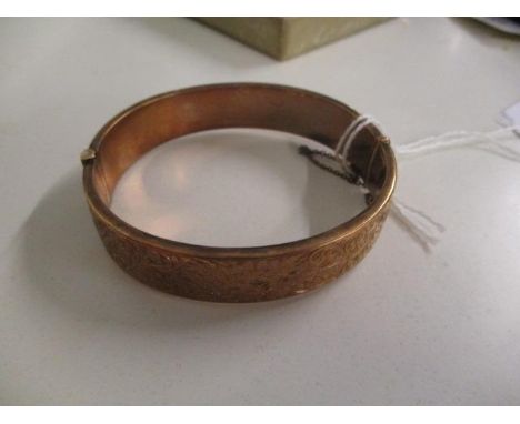 A 9ct gold bangle, total weight 15.50g 