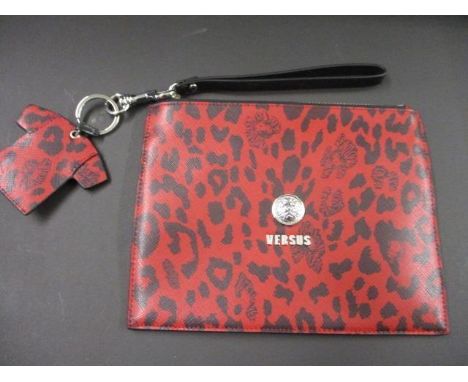 A Versus Versace clutch bag with a matching key ring/handbag charm in a red leopard print design and iconic Versace disc to t