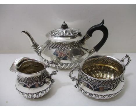 A Victorian silver three piece bachelors teaset by L Spiers, Birmingham 1892 with reeded, fluted and ring ornament, comprisin