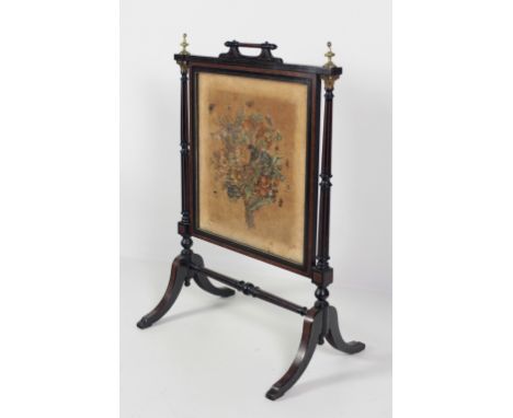 An attractive Aesthetic movement ebonised Fire Screen, with crossbanded and inlaid walnut panels the velvet central panel pai