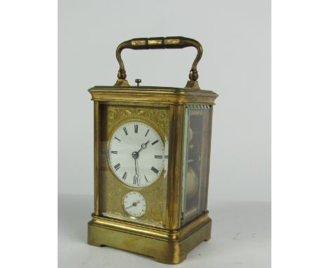 A fine quality and very attractive 19th Century brass Repeater Carriage Clock, with two circular enamel dials inside a finely
