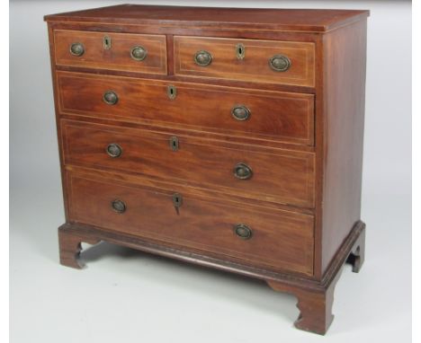 An attractive early 19th Century inlaid and crossbanded mahogany Chest, of two short and three long drawers with decorative b