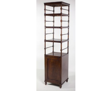 An unusual tall and narrow mahogany Dumbwaiter, with five shelves on turned supports, over a press with figured mahogany pane