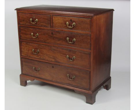 A small Irish Georgian mahogany Chest of two short and three long drawers with brass drop handles, on bracket feet, 90cms (35