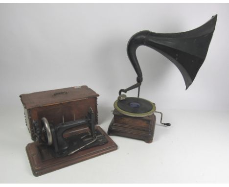 A 19th Century wooden cased Table Gramaphone, with large tin horn speaker; together with a 19th Century Sewing Machine in att