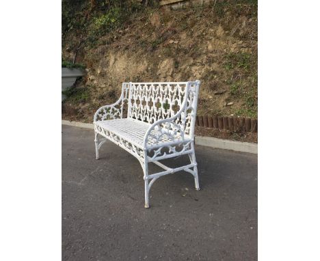 A good large Victorian cast metal Garden Bench, with pierced back and sides, decorated in the rustic style, over a honeycomb 