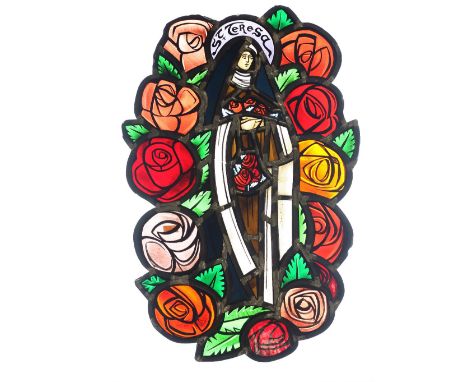 An attractive small stained glass Panel, "St. Teresa," in the style of Evie Hone, 51cms (20"). (1)