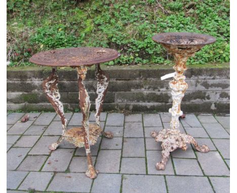 A small heavy Victorian metal circular Garden Table, with decorated pierced top on three monopodia supports with triform shel