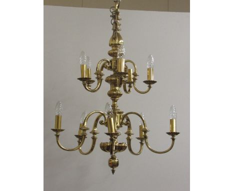An attractive heavy brass graduating two tier, ten branch Ceiling Light, 109cms (43") high. (1)